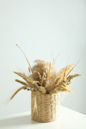 Basket of dried floral arrangement vertical composition