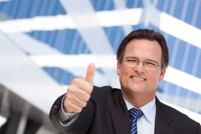 Confident Businessman with Thumbs Up