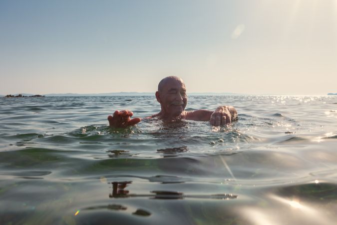 Man swimming under water in sea