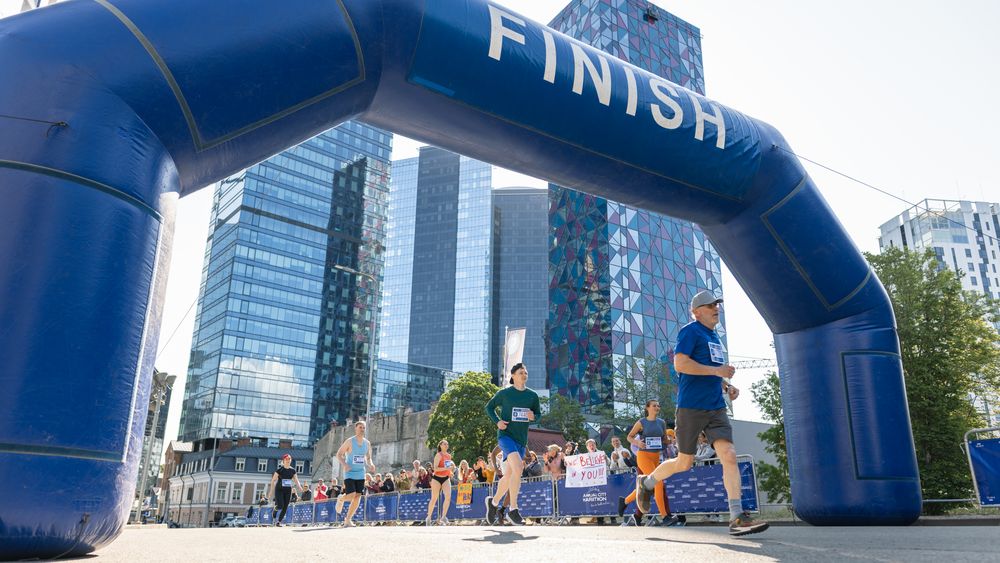 Smiling Group of People Participating in a City Marathon.