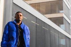 Stylish Black man in sunglasses on street