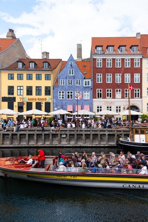 Tourist boat going past riverfront in Copenhagen