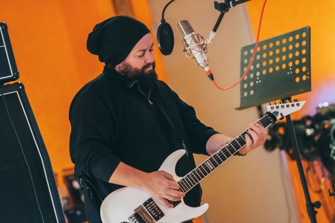 Musician playing guitar and singing