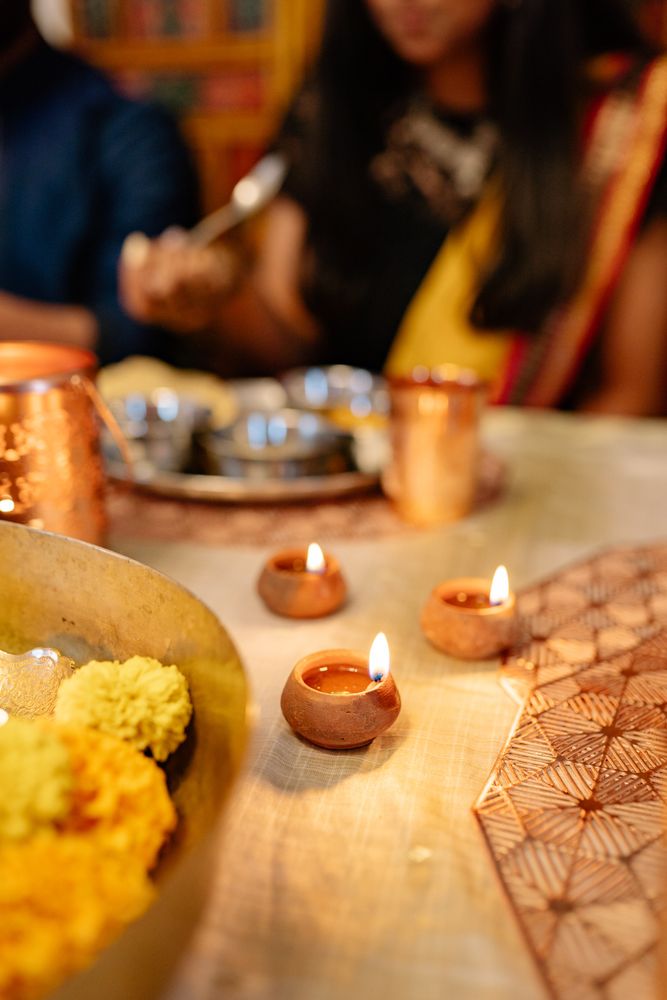 Lit diyas on dinner table