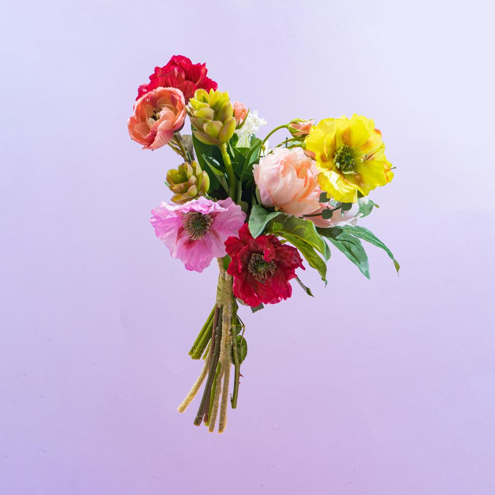 Colorful flower bouquet on purple gradient background