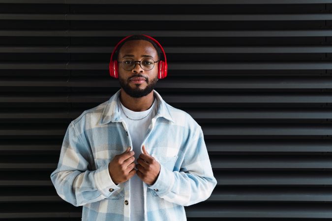Black man in headphones and jacket