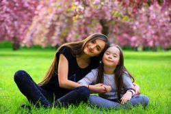 Young adult playing with sister at a park