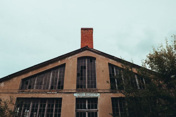 Facade of old building and cloudy sky