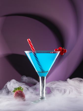 Glass with drink and berries