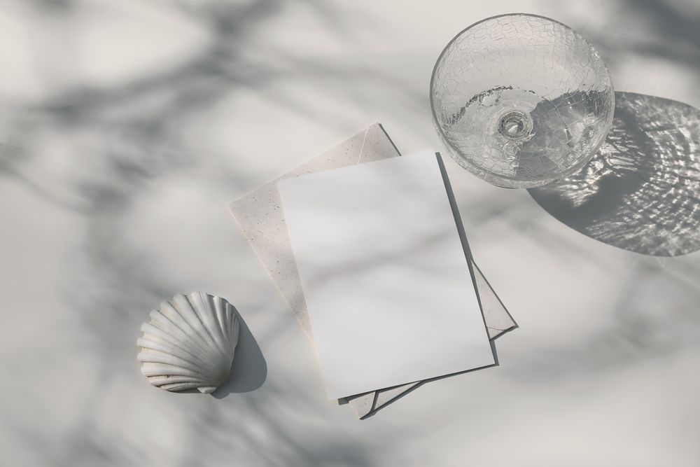 Summer marine neutral stationery, desktop mock-up scene with glass of water and seashell
