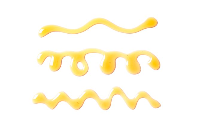 Sweet honey smears isolated on studio background