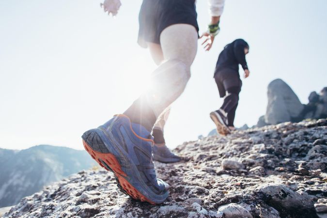 Two men jogging uphill