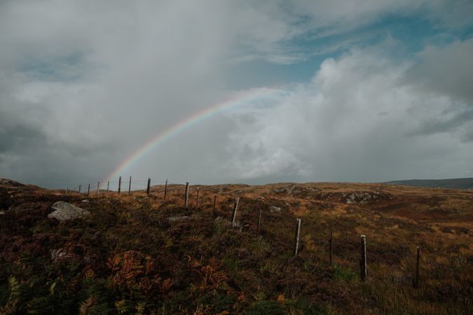 Scottish fields separated by fence in autumn