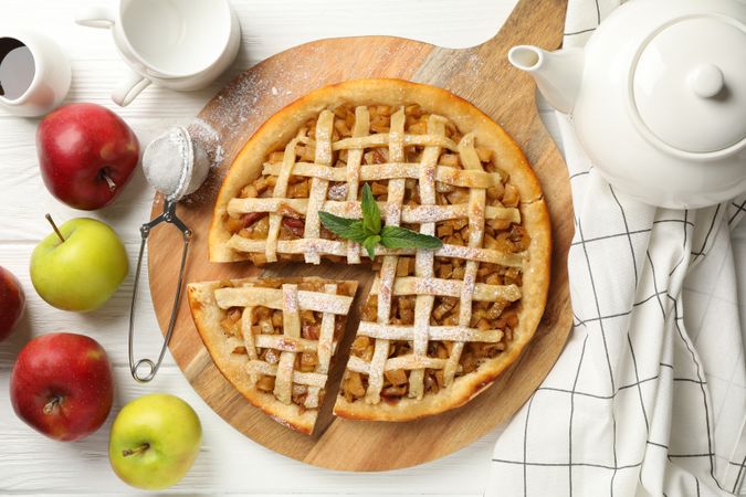 Composition with apple pie on wooden background. Tasty lunch. Homemade breakfast