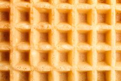 Belgian waffles texture as background, closeup