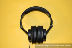 Headphones in yellow studio shoot 4d81Bn