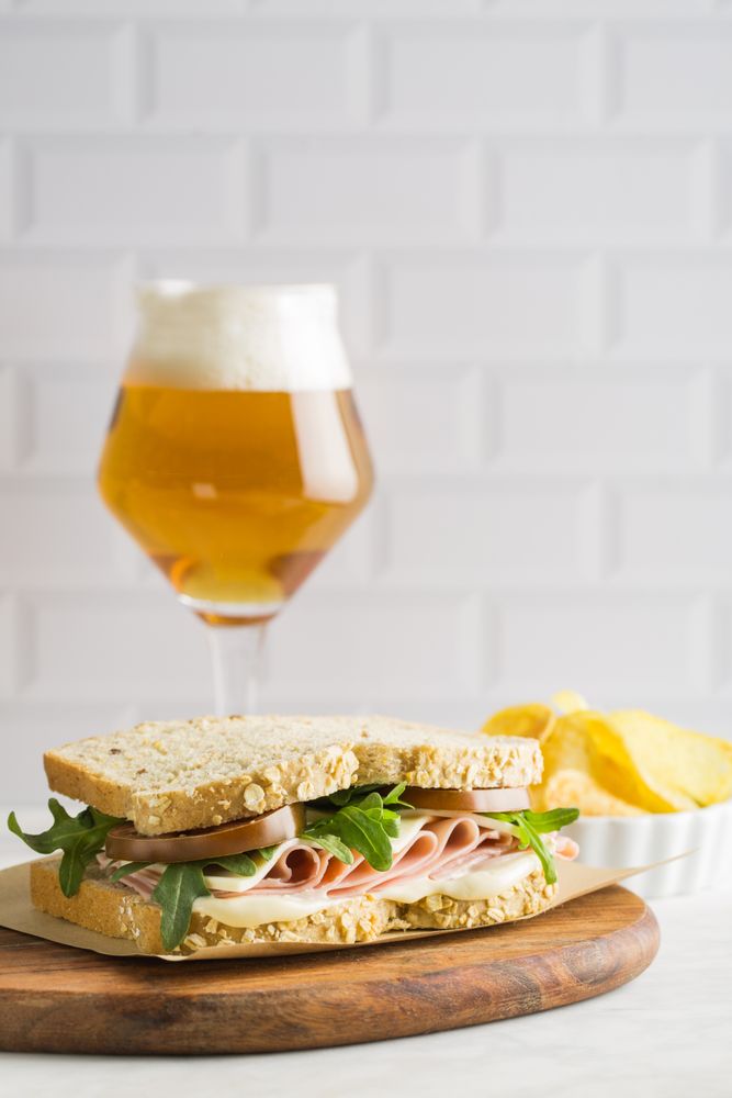 Delicious sandwich with ham, cheese, lettuce and tomato