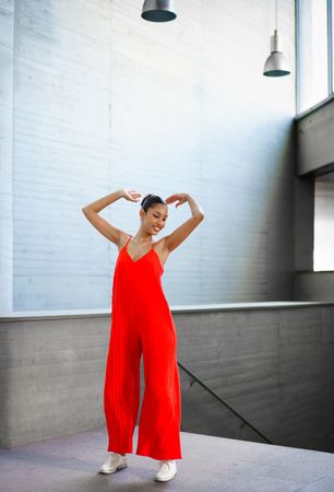 An Elegant Dance Pose Captured in a Stunning and Vibrant Red Outfit with Dynamic Movement