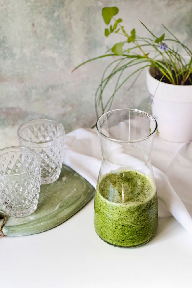 Organic Green smoothie detox drink in a glass bottle