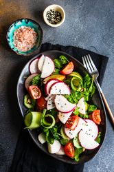 Plate of healthy vegetable salad on rustic background