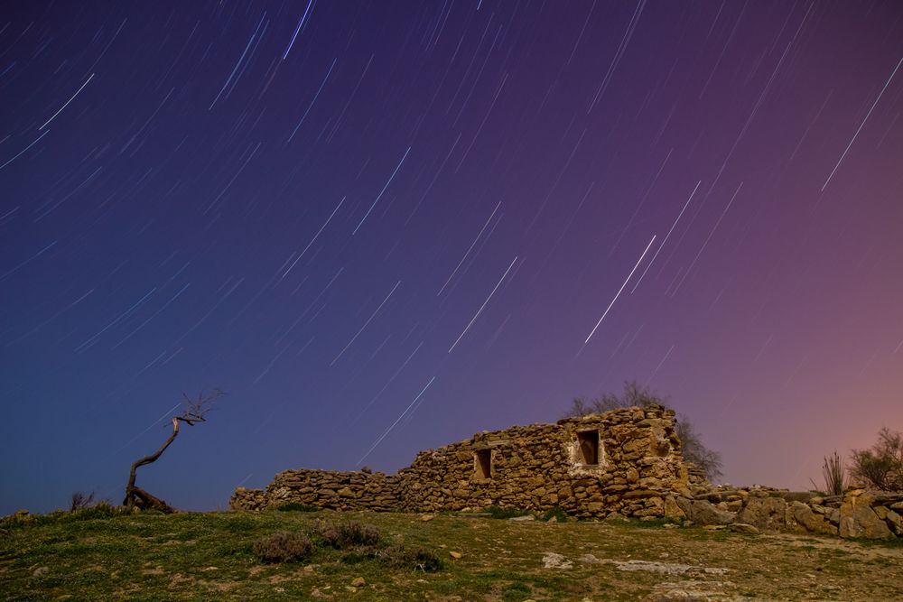 Ancient stone building on hill and wonderful sky