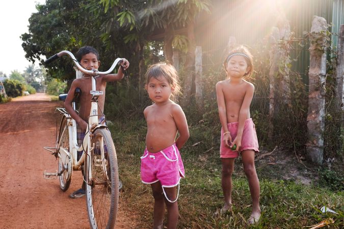 Siem Reap, Cambodia - Feb 13, 2018 - Children and bike