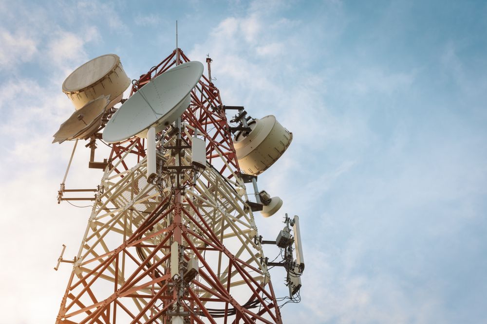 Communication Tower with Antennas Against a Clear Sky Background