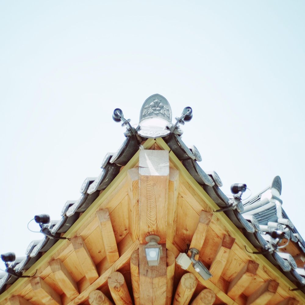 Brown and gray wooden and tiled roof in close-up