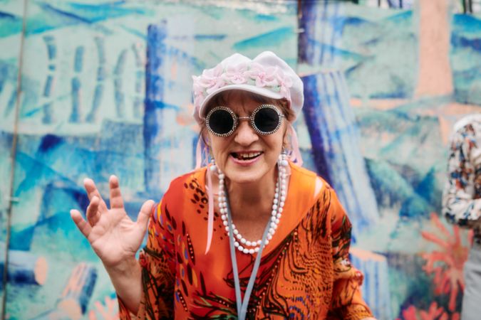 London, England, United Kingdom - August 28, 2022: Woman in floral hat and decorative glasses