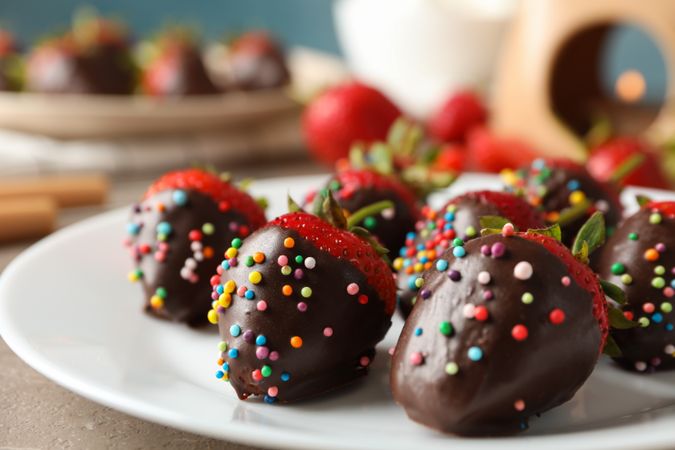Composition with strawberry in chocolate, close up. Chocolate fondue