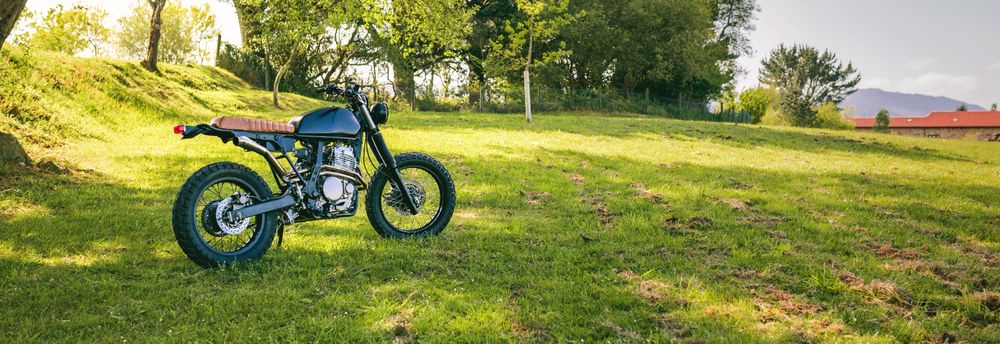 Custom motorcycle parked on the field