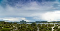 Panoramic view of tropical coastline with mountains
