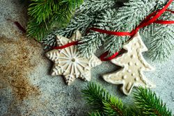 Christmas card concept of pine tree with ornaments on ribbon