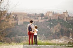 Mother and daughter overlooking beautiful Spanish town 5we9Ab