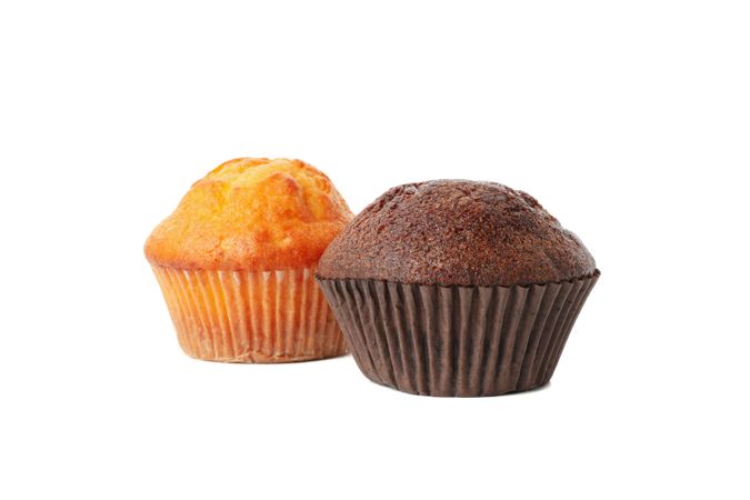 Delicious tasty muffins isolated on light background