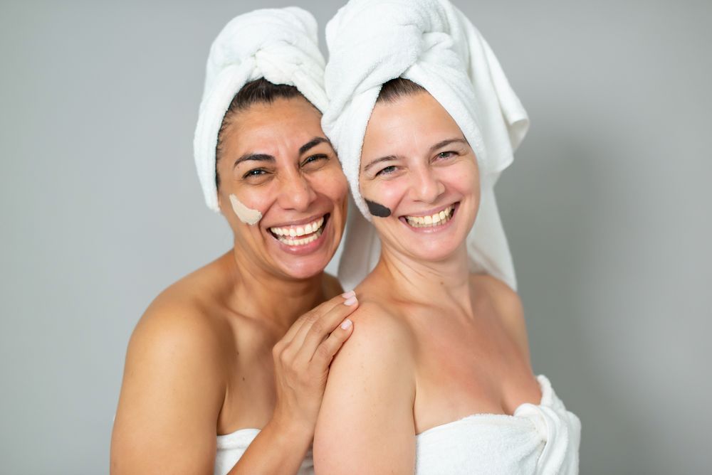 Happy women with strokes of masks
