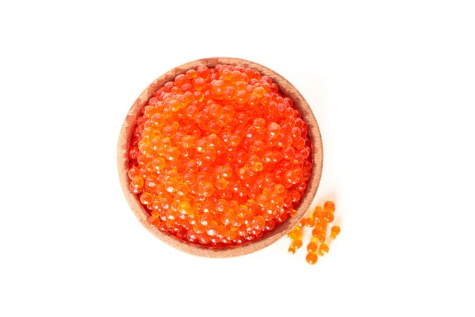Wooden bowl with caviar isolated on plain background
