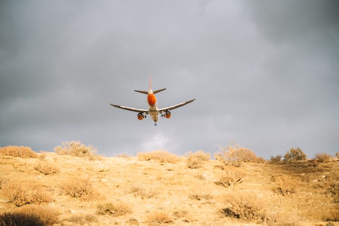 Big plane under grey sky