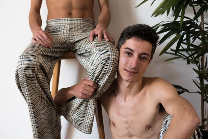 Stylish shirtless gay couple posing