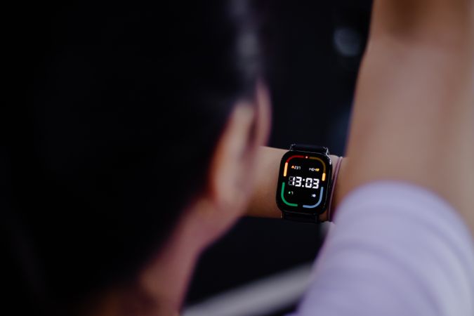 Modern smartwatch display showing time during outdoor activity,