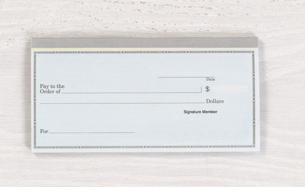 Blank checkbook on desktop