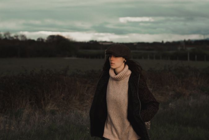 Young woman in warm clothes in forest