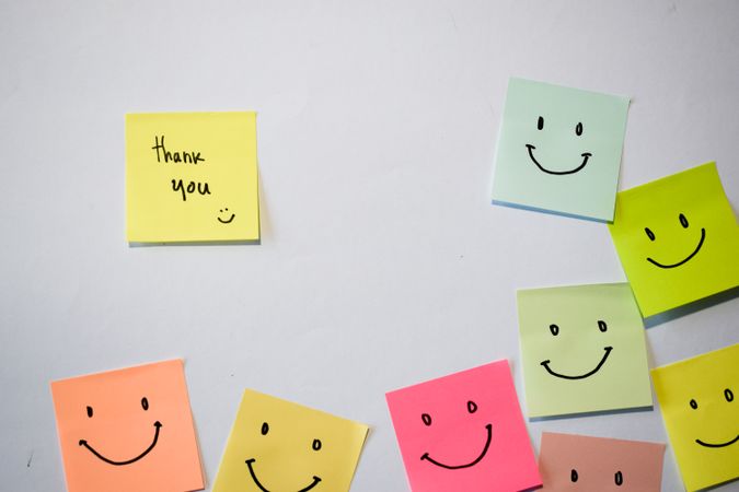 Thank you and smile emoticon on sticky notes