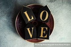 St. Valentine day card concept of the word love spelled out on plate 5RVV1B