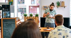 Young cook giving a cooking workshop