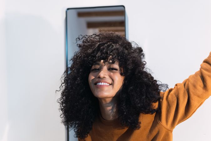 Smiling woman with curly hair