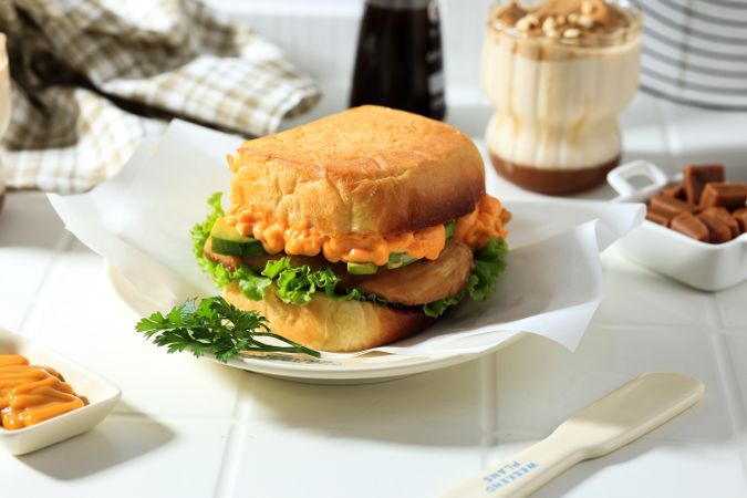 Sandwich with Chicken, Avocado, Cheese Sauce, and Lettuce