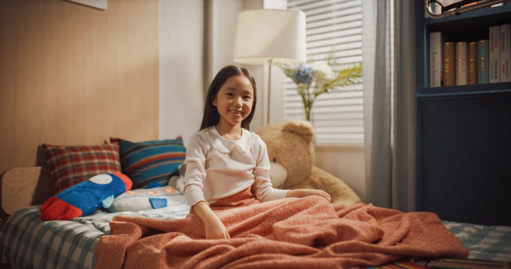 Portrait of a Cute Happy Korean Girl Waking Up After a Nap in Her Lovely Room.