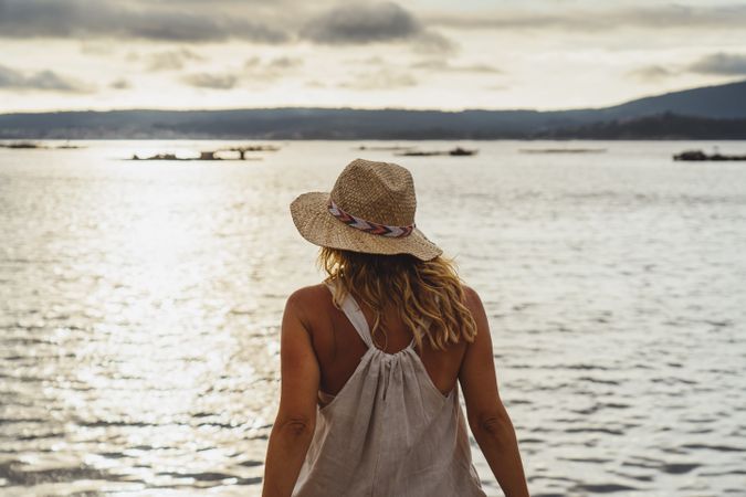 Blond woman resting at seaside