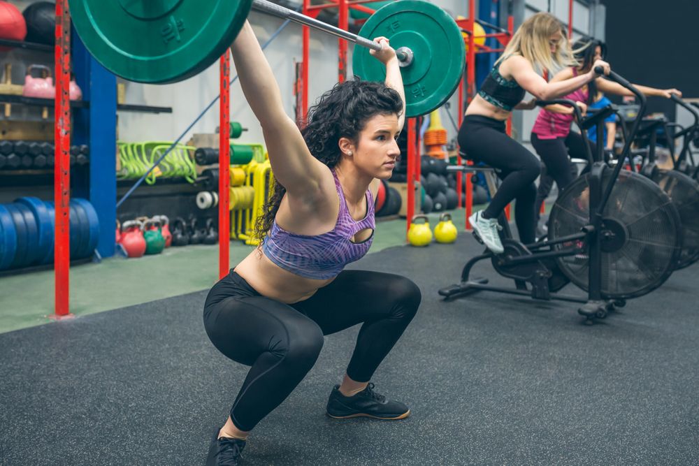 Woman practicing weightlifting in the gym